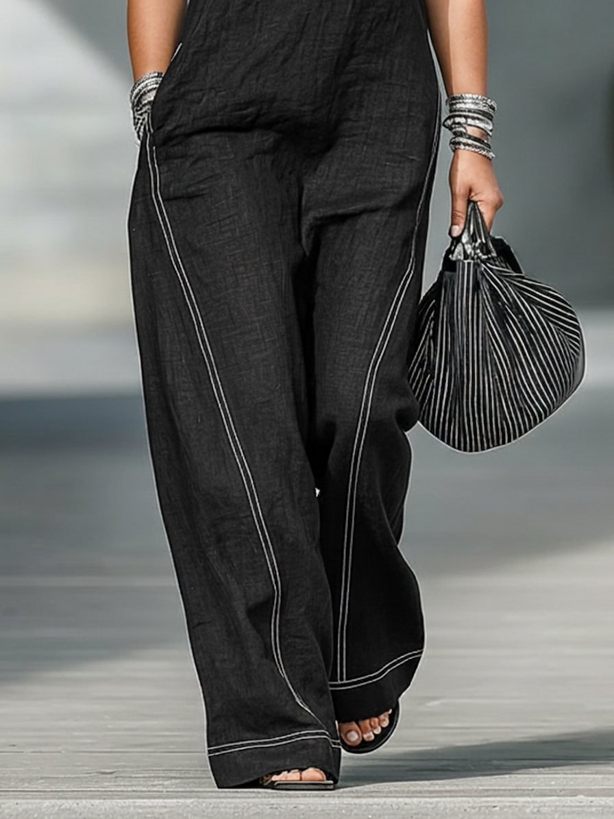 Kvindernes minimalistiske ærmeløse jumpsuit med hvid kant